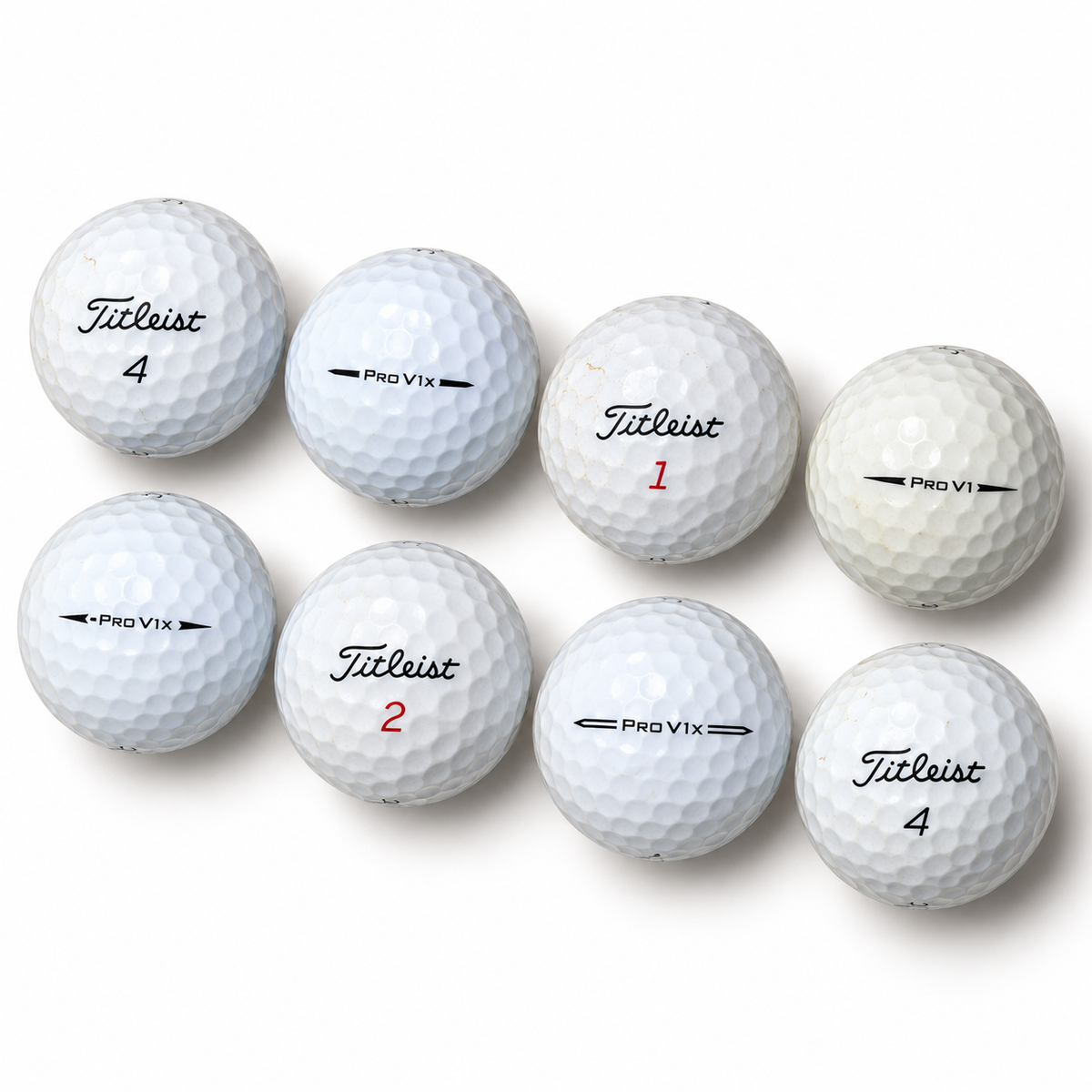 Eight white Titleist Pro V1 and Pro V1x golf balls in diagonal rows