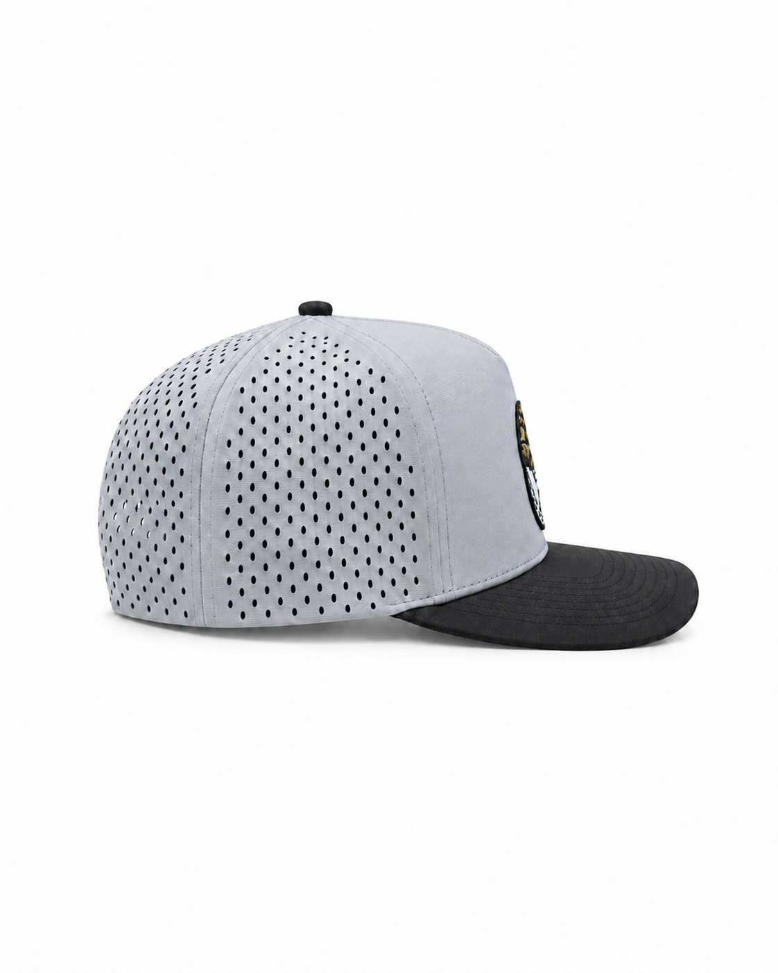 Peaky snapback hat in grey with a black brim and a perforated side panel, side view