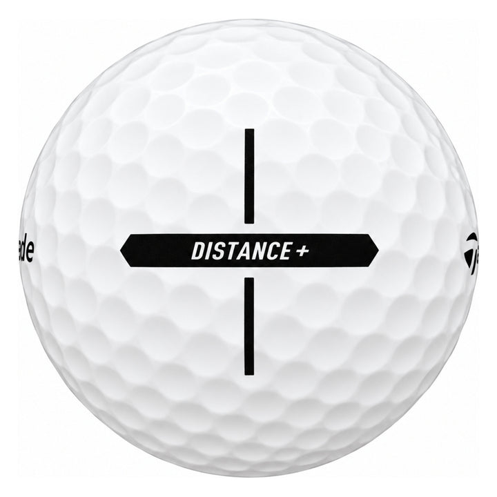 TaylorMade Distance+ golf ball in white, showing the cross-shaped alignment stamp