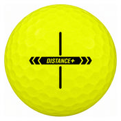 TaylorMade Distance+ golf ball in yellow, showing the cross-shaped alignment stamp